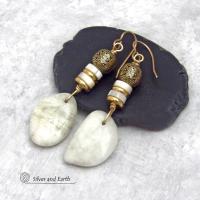 These earrings feature natural white moonstone nuggets accented with white Mother of Pearl and brass beads. They are topped off with larger brass beads that have an intricate filigree design. They have a modern chic style with a touch of exotic flair that looks great with all wardrobe types. They'll make a great gift for a natural stone lover - or a nice addition to your own jewelry collection.
