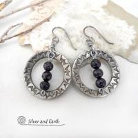 These handcrafted silver pewter hoop earrings have a hand stamped texture accented with black lava rock stones dangling in front. The stones have natural "pits" and crevices which is expected with porous lava stones. Lava stone is formed when molten rock erupts from an active volcano and comes in contact with the cool atmosphere of the Earth, which begins to solidify it. They have an earthy chic style that coordinates with all wardrobe types.