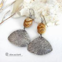 These handcrafted earrings feature natural picture jasper stones accented with textured sterling silver dangles. They have a modern, earthy design that looks great with all wardrobe styles. The stones have a natural pattern of brown streaks and black speckles against a tan background. I created the dangles out of solid sterling silver sheet; hammered them for an earth, organic texture; then oxidized them to enhance the detail. Earrings have a coordinating necklace sold separately. 