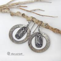 These handcrafted earrings feature silver pewter circle hoops with a hammered texture accented with silver pewter bird charms dangling in front. Lightweight and comfortable to wear, they have a casual earthy style with rustic flair that coordinates with all wardrobe types. They'll make a great gift for a nature / bird lover - or a unique addition to your own jewelry wardrobe. Handmade in the USA by Silver and Earth Jewelry.