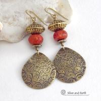 These handcrafted gold brass earrings have a hand stamped and hammered texture and are accented with faceted red coral, brass tribal style beads and faceted hematite stone beads with an electroplated champagne gold tone finish. Big and bold, they have a modern boho chic vibe with a tribal flair that makes a striking statement. Perfect for women that love to wear unique and eye-catching artisan handcrafted jewelry. Handmade in the USA by Silver and Earth Jewelry.
