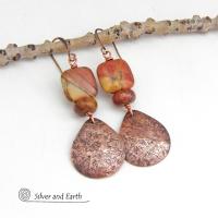 These earrings feature natural red creek jasper gemstones accented with handcrafted copper teardrop dangles. The stones have earthy hues of soft brick red, orange, golden yellow and streaks of brown and green. They'll make a great gift for a natural stone lover - or couples celebrating their 7th wedding anniversary - copper is the traditional choice for this occasion.