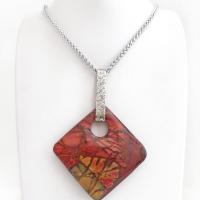 This artisan handcrafted one-of-a-kind necklace features a natural red creek jasper stone accented with a hand forged sterling silver bail with a lightly hammered texture. The stone has a beautiful natural pattern in earthy hues of mossy greens, brick red, brown and orange. It's reversible and can be worn on either side. (See all photos for alternate sides). It makes a great gift for anyone that loves earthy colors and natural stones. The design is unisex so it could be worn by a man or woman.