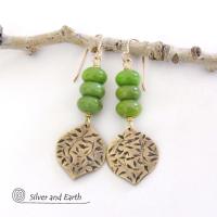  These handcrafted earrings feature gold brass dangles with a hand stamped texture accented with a stack of green serpentine gemstones. They have an earthy chic, modern style that coordinates well with all wardrobe types.These artisan-made earrings are perfect for adding a touch of earthy modern style to any outfit.  