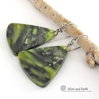These one-of-a-kind earrings feature gorgeous slices of natural serpentine gemstones in hues of green and black, along with a sprinkling of sparkly pyrite inclusions. They have an earthy, modern style that looks great with all wardrobe types. Makes a great gift for a natural stone lover - or a nice addition to your own jewelry collection.