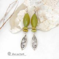 These sterling silver earrings have an earthy, classic and modern feel. They feature sterling silver leaf shapes with a scrolling spiral pattern accented with natural green serpentine gemstones. Lightweight and comfortable to wear, they'll coordinate with all wardrobe styles. 