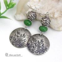 These handcrafted sterling silver earrings feature a hand stamped leaf design and are accented with green serpentine gemstones and pewter beads. The beads have a beautifully detailed 3-dimensional carved pattern of vines and leaves. They have a modern, earthy and elegant style that coordinates beautifully with all wardrobe types. They'll make a great gift for a nature lover - or a nice addition to your own jewelry wardrobe.