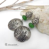 Handcrafted sterling silver earrings with a gorgeous hand stamped leaf design accented with earthy green serpentine gemstones and pewter beads with a detailed 3-dimensional carved pattern of vines and leaves. They have a modern, earthy and elegant style and will make a great gift for a nature lover. Handmade in the USA by Silver and Earth Jewelry. 