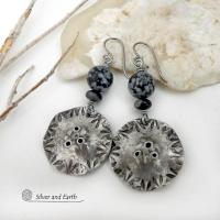 Handcrafted earrings with a modern bold edgy vibe. They feature rustic hammered and hand stamped silver tone pewter dangles accented with natural snowflake obsidian gemstones. The stones have a natural pattern in hues of black and soft gray. This stone is a natural volcanic glass which contains the mineral cristobalite - which creates the "snowflake" type patterns. Bold and striking - they're sure to make a statement. Perfect for women that love natural stones and unique artisan handmade jewelry. 