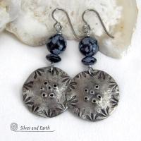 These handcrafted earrings have a modern bold edgy vibe. They feature rustic hammered and hand stamped silver tone pewter dangles accented with natural snowflake obsidian gemstones. The stones have a natural pattern in hues of black and soft gray. This stone is a natural volcanic glass which contains the mineral cristobalite - which creates the "snowflake" type patterns. Bold and striking - they're sure to make a statement. Perfect for women that love natural stones and unique artisan handmade jewelry. 