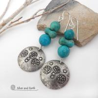 These handcrafted earrings feature sterling silver dangles with a hand stamped texture accented with a stack of round and uniquely "bow shaped" genuine natural turquoise stones. Bold and striking, they have an earthy modern rustic vibe with southwest style and flair that will look great with all types of outfits. Handmade in the USA, Silver and Earth is a small business that is New Mexico True Certified. She is known for her known for her unique one-of-a-kind and limited edition designs.