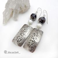 These handcrafted sterling silver earrings have a hand stamped and lightly hammered organic texture and are accented with natural sunstone / moonstone gemstones and mother of pearl and small stainless steel beads. This hybrid stone is rare and found only in Tanzania. It has beautiful shimmery hues of black with natural silvery flashes and subtle peach and gold inclusions. These earrings have a modern, elegant chic style that looks great dressed up or down. Perfect for women that love unique gemstone jewelry