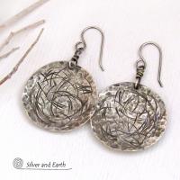 These handcrafted sterling silver earrings have modern, contemporary style and are perfect for everyday wear -- they go with everything. They have a hammered and hand stamped abstract texture that was oxidized to highlight the details. Lightweight and comfortable to wear, they'll coordinate beautifully with all wardrobe styles.