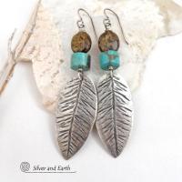 These handcrafted sterling silver feather earrings have a hand stamped texture and are accented with turquoise and bronzite stones which bring out the natural brown matrix in the turquoise stones. They have a native southwestern vibe that makes a bold statement. The earrings are handmade and are a beautiful example of southwest style jewelry. New Mexio True certified. 