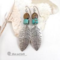 These handcrafted sterling silver feather earrings have a hand stamped texture and are accented with turquoise and bronzite stones which bring out the natural brown matrix in the turquoise stones. They have a native southwestern vibe that makes a bold statement. The earrings are handmade and are a beautiful example of southwest style jewelry. New Mexio True certified. 
