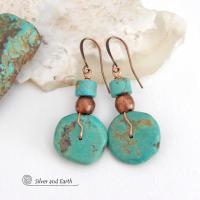 Chunky natural turquoise gemstones are wrapped in copper wire and are accented with copper and turquoise beads in these modern southwest style earrings. They have a casual, earthy style and will make a great gift for anyone that loves natural turquoise stone jewelry - or a nice addition to your own jewelry wardrobe. Handmade in the USA by Silver and Earth Jewelry.