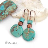 Chunky natural turquoise gemstones are wrapped in copper wire and are accented with copper and turquoise beads in these modern southwest style earrings. They have a casual, earthy style and will make a great gift for anyone that loves natural turquoise stone jewelry - or a nice addition to your own jewelry wardrobe. Handmade in the USA by Silver and Earth Jewelry. 