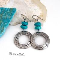 These handcrafted earrings feature silver pewter hoops with a hand stamped texture accented with natural, genuine turquoise stones with a faceted finish. They have an earthy modern style with southwest flair that coordinates beautifully with all wardrobe types. Handmade in the USA by Silver and Earth Jewelry, a New Mexico True Certified Business.