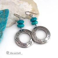 These handcrafted earrings feature silver pewter hoops with a hand stamped texture accented with natural, genuine turquoise stones with a faceted finish. They have an earthy modern style with southwest flair that coordinates beautifully with all wardrobe types. Handmade in the USA by Silver and Earth Jewelry, a New Mexico True Certified Business.
