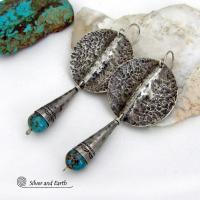 Big and bold - these handcrafted sterling silver earrings have an earthy, organic design with an edgy, modern southwest style. They feature solid sterling silver with a rustic, hammered texture and a dark oxidized finish. They are accented with hammered and hand stamped sterling silver cones and natural turquoise stone beads. Perfect for women that love to wear bold organic looking jewelry with a subtle southwest style and flair. Handmade in USA by Silver and Earth, a New Mexico True Certified Business.