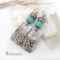 These handcrafted earrings feature sterling silver rectangles with a hammered and hand stamped texture accented with natural turquoise stones. They are topped off with oxidized and stamped Native American made sterling silver beads.They have a modern, southwest tribal style and will make a bold statement. Perfect for anyone that loves southwest style jewelry. The earrings are handmade and are a beautiful example of southwest style jewelry. Handmade by Silver and Earth, a New Mexico True Certified business.