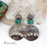 These handcrafted earrings feature uniquely textured hammered and hand stamped sterling silver accented with natural turquoise stones and silver plated beads. Bold and striking, they have a modern, southwest style with a touch of tribal flair. Handmade in the USA by Silver and Earth Jewelry. 