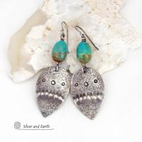These handcrafted earrings feature natural turquoise nuggets accented with sterling silver dangles with a hammered and hand stamped texture. The stones are a gorgeous shade of turquoise with a natural copper matrix. They have an earthy organic, modern style with southwestern flair.
