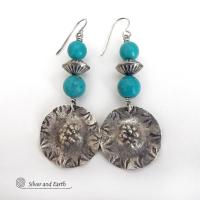 These handcrafted sterling silver earrings have a rustic hammered and hand stamped texture and are accented with a stack of turquoise and sterling silver beads. The silver beads have a fluted corrugated texture and an oxidized satin finish. Bold and striking, they have an earthy organic vibe with southwest style and flair that will look great with all types of outfits. Handmade by Silver and Earth, a New Mexico True Certified business. 