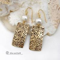 These handcrafted earrings feature gold brass rectangles with an intricate hand stamped texture accented with white freshwater pearls. They have a modern, elegant chic and feminine style that looks great dressed up or down. They'll make a great gift for couples celebrating their 21st wedding anniversary - brass is the traditional choice for this occasion. Also makes a great birthday gift for someone born in June - pearl is the birthstone for that month. Handmade in the USA by Silver and Earth Jewelry. 