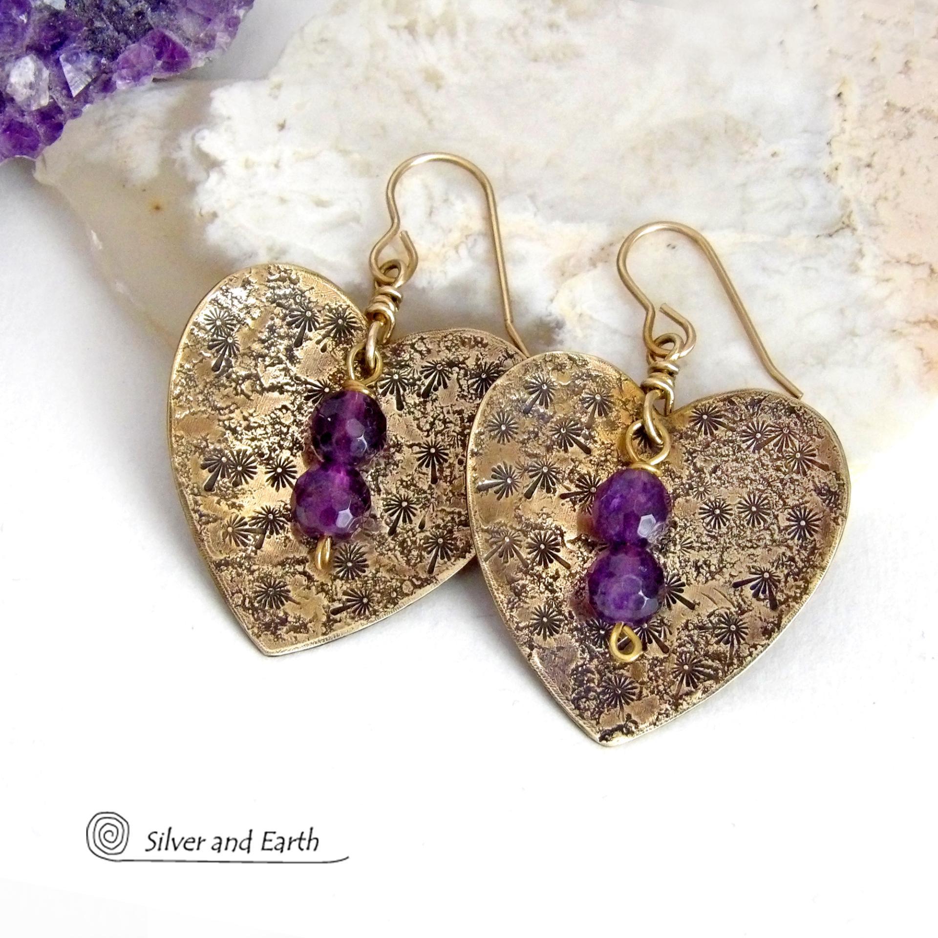 These gold brass heart earrings have a romantic, feminine charm and will make a great gift for someone special. They feature handcrafted gold brass hearts with a hand stamped texture accented with faceted amethyst gemstones dangling in front. The perfect gift to say "I love you" on Valentine's Day or any day! They'll also make a great gift for someone born in February - amethyst is the birthstone for this month.  Makes a great gift for couples celebrating their 21st wedding anniversary.
