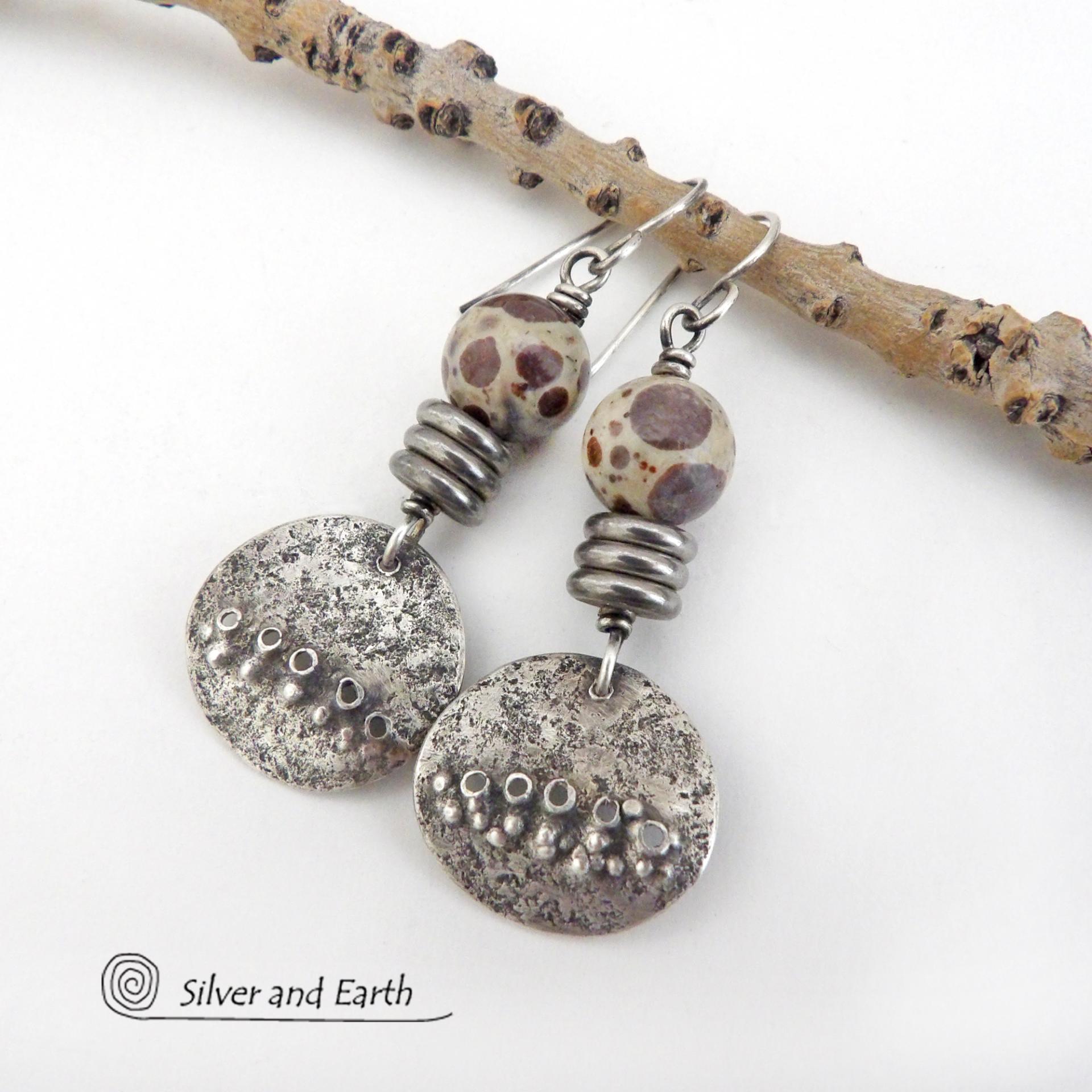 Small and petite, but full of unique earthy charm - these handcrafted sterling silver earrings have a funky edgy vibe. They feature rustic hammered small sterling silver dangles accented with natural asteroid jasper stones and a stack of stainless steel beads. This type of stone is known for its unique dotted matrix in earth-tone hues of brown, gray and tan. It's also known as chocolate ocean jasper because it's found on the shores of Madagascar where ocean jasper is also found.