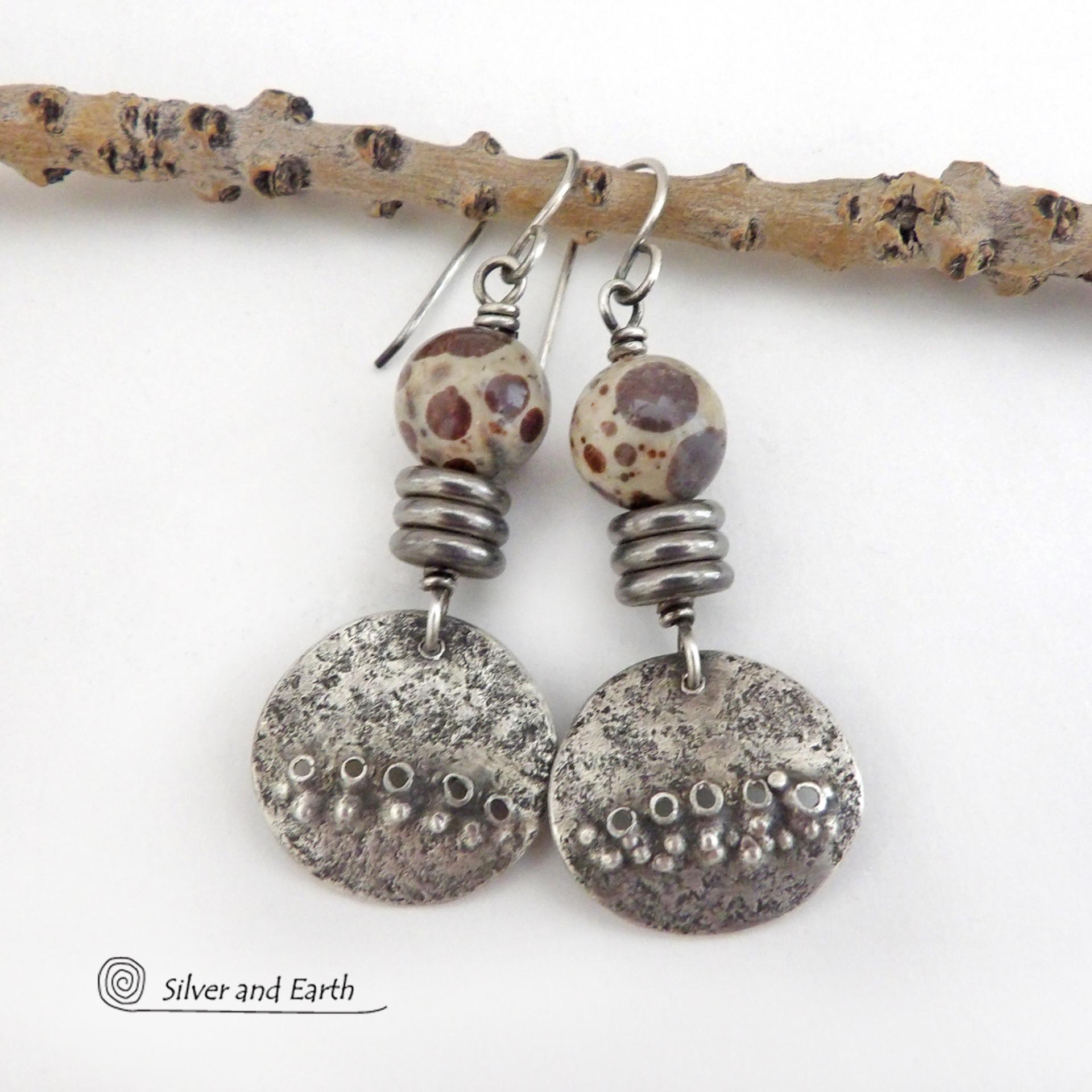 Small and petite, but full of unique earthy charm - these handcrafted sterling silver earrings have a funky edgy vibe. They feature rustic hammered small sterling silver dangles accented with natural asteroid jasper stones and a stack of stainless steel beads. This type of stone is known for its unique dotted matrix in earth-tone hues of brown, gray and tan. It's also known as chocolate ocean jasper because it's found on the shores of Madagascar where ocean jasper is also found.