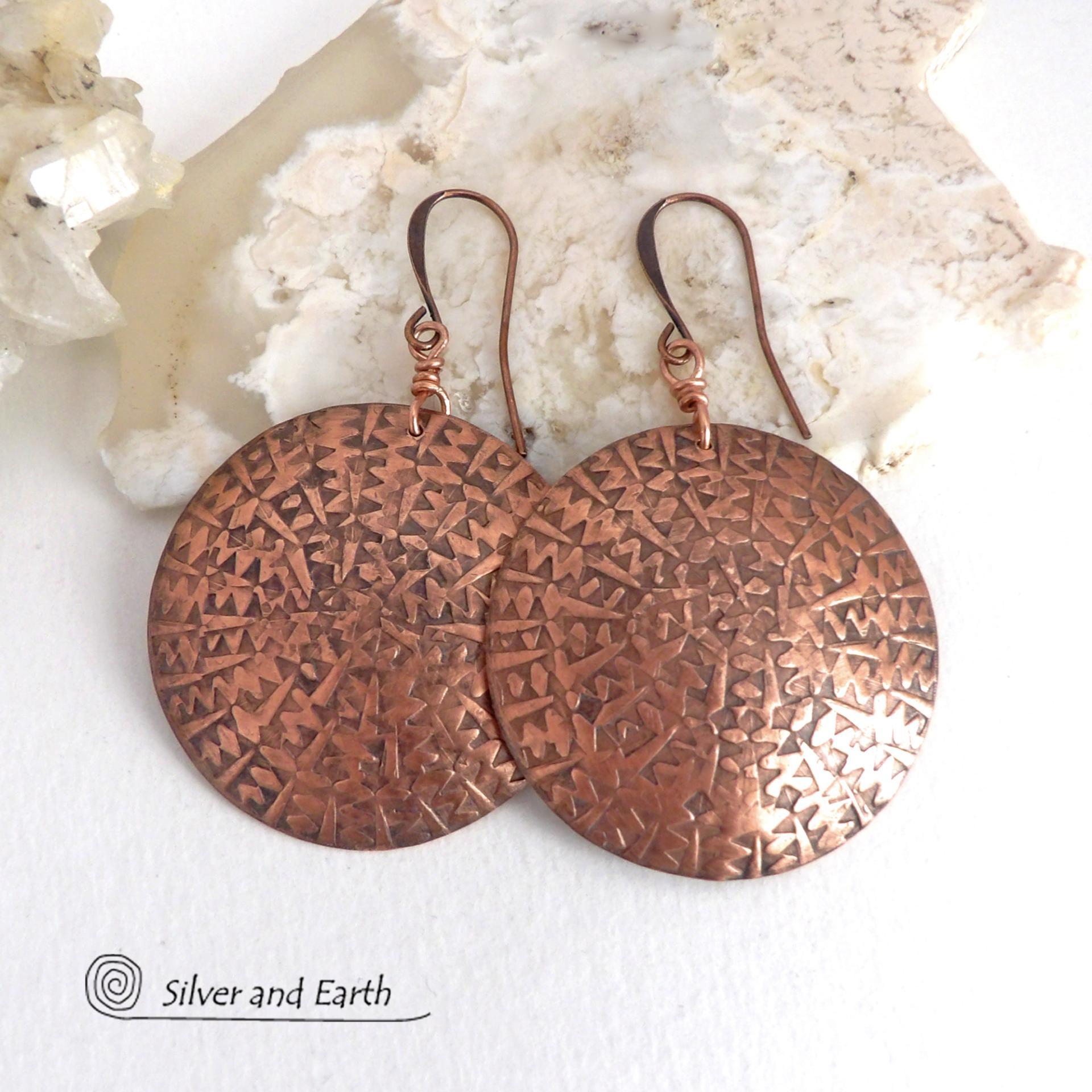 Big, bold and dramatic - these handmade copper earrings will make a statement. Unique and versatile, they'll look great with all wardrobe styles. They feature large copper circles with an intricate hand stamped texture and oxidized finish.