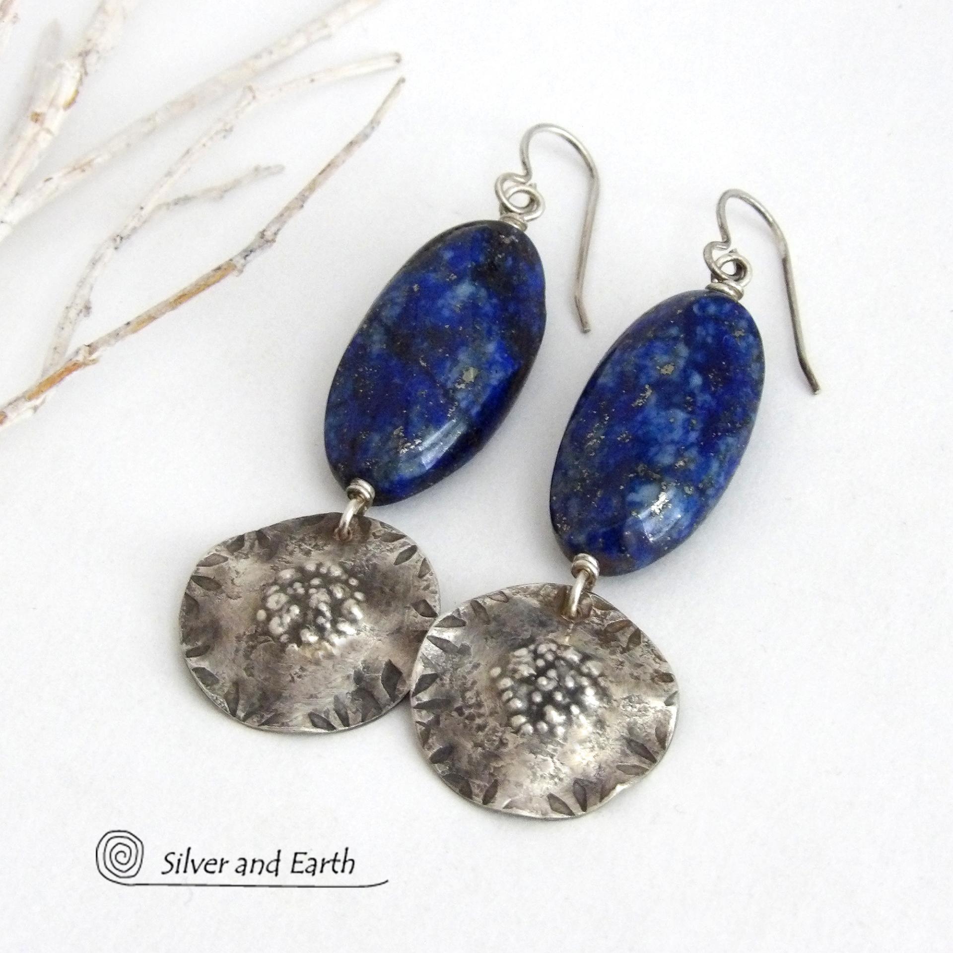 Handcrafted earrings with large blue lapis lazuli gemstones with a faceted finish accented with sterling silver dangles. Unique and one-of-a-kind, they'll make a bold statement.