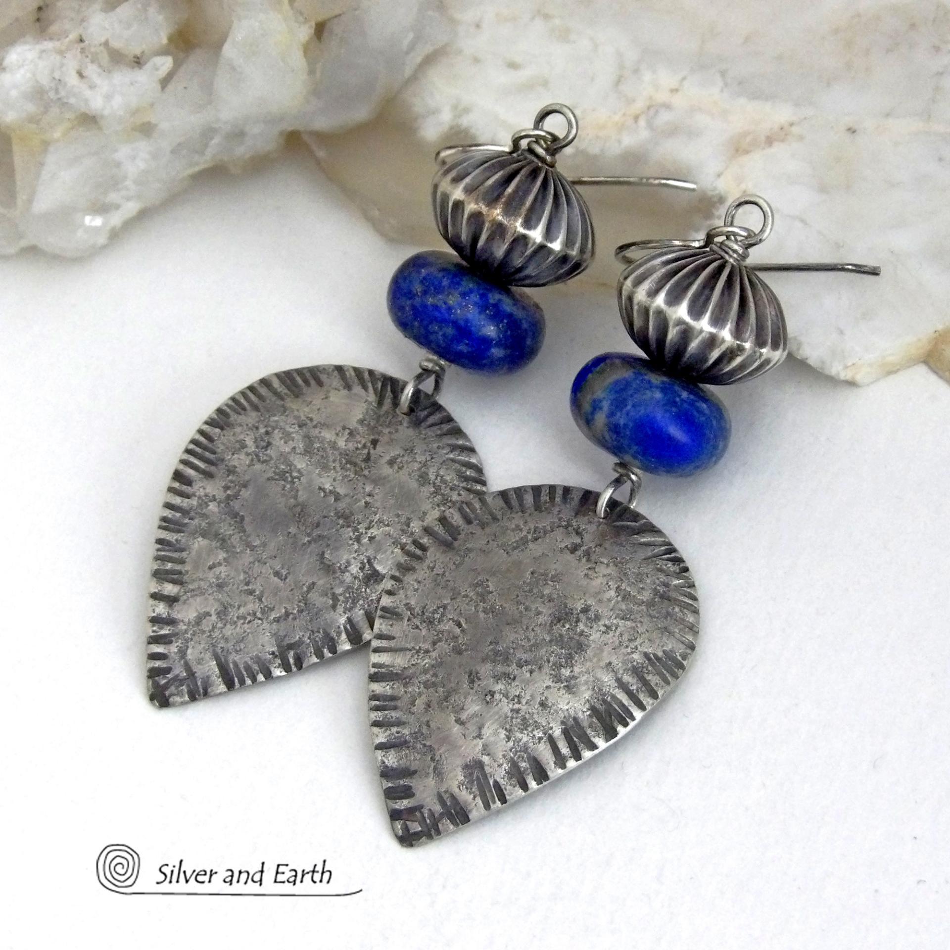 Big and bold - these earrings feature handcrafted sterling silver dangles with a rustic, organic texture accented with chunky natural blue lapis lazuli gemstones and Native style oxidized sterling silver beads with a rich, corrugated texture. They have a modern southwestern and tribal flair that makes a bold statement. Perfect for women that love artisan handcrafted southwest Santa Fe style jewelry. Handmade in the USA by Silver and Earth Jewelry - a New Mexico True Certified Business. 