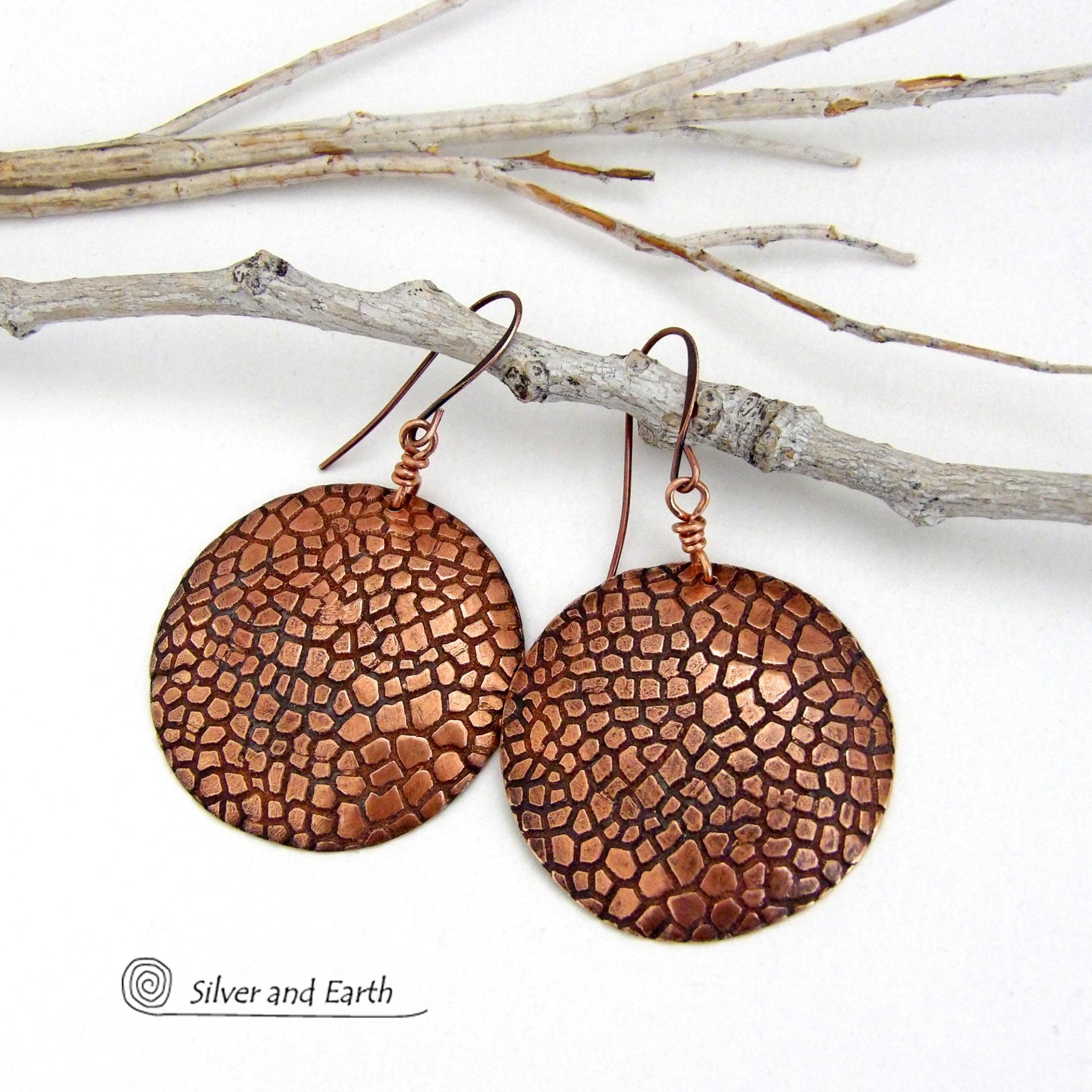 These handcrafted copper earrings have a beautifully detailed embossed cobblestone texture. Big and bold, they'll make a striking statement. Unique and versatile, they are lightweight and comfortable to wear and will look great with all wardrobe styles. Handmade in the USA by Silver and Earth Jewelry. Your choice of ear wire - copper or hypoallergenic niobium.