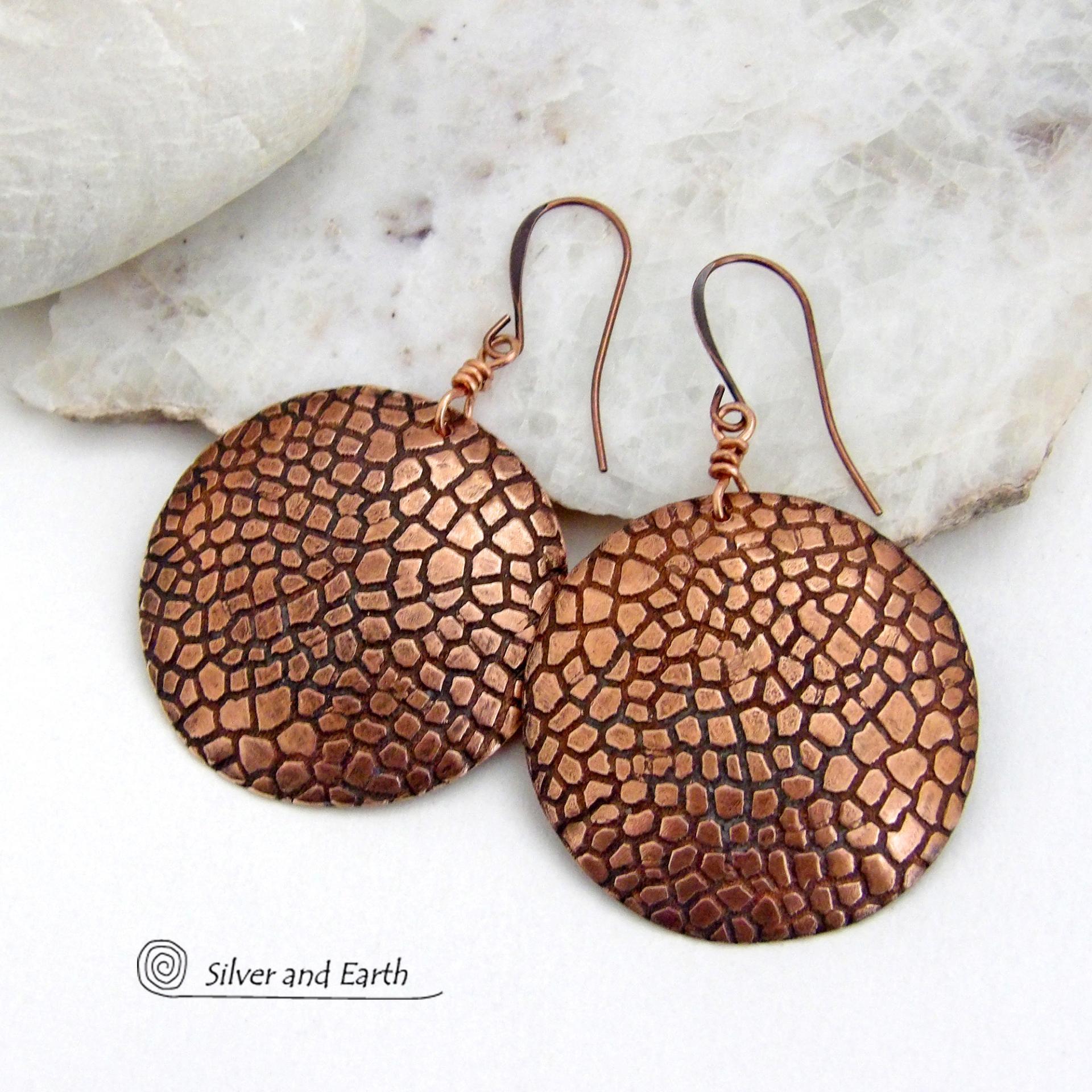 These handcrafted copper earrings have a beautifully detailed embossed cobblestone texture. Big and bold, they'll make a striking statement. Unique and versatile, they are lightweight and comfortable to wear and will look great with all wardrobe styles. Handmade in the USA by Silver and Earth Jewelry. Your choice of ear wire - copper or hypoallergenic niobium.