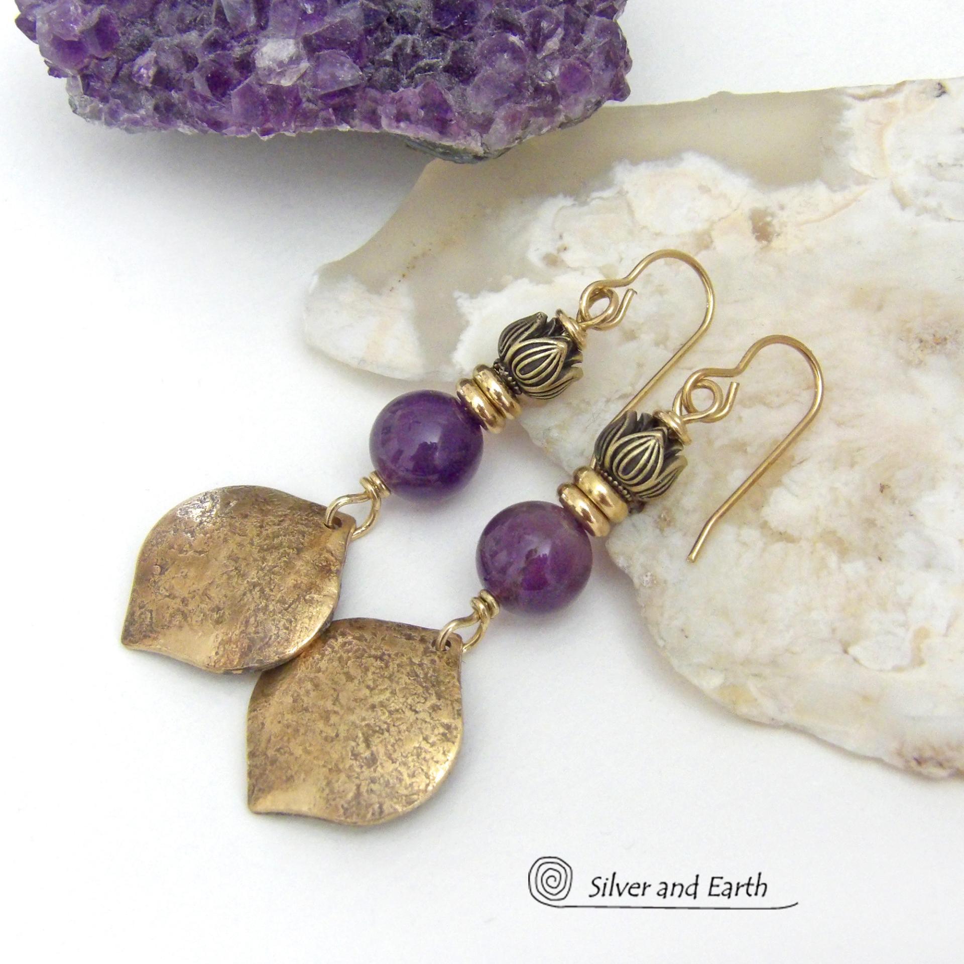 These handcrafted gold brass earrings have a hammered raw silk texture and are accented with natural purple amethyst gemstones, tiny brass beads and tulip flower-shaped brass beads. They have a modern elegant chic style that coordinates beautifully with all wardrobe types - dressed up or down. Makes a great gift for someone with a February birthday - amethyst is that month's birthstone. Handmade in the USA by Silver and Earth Jewelry. 