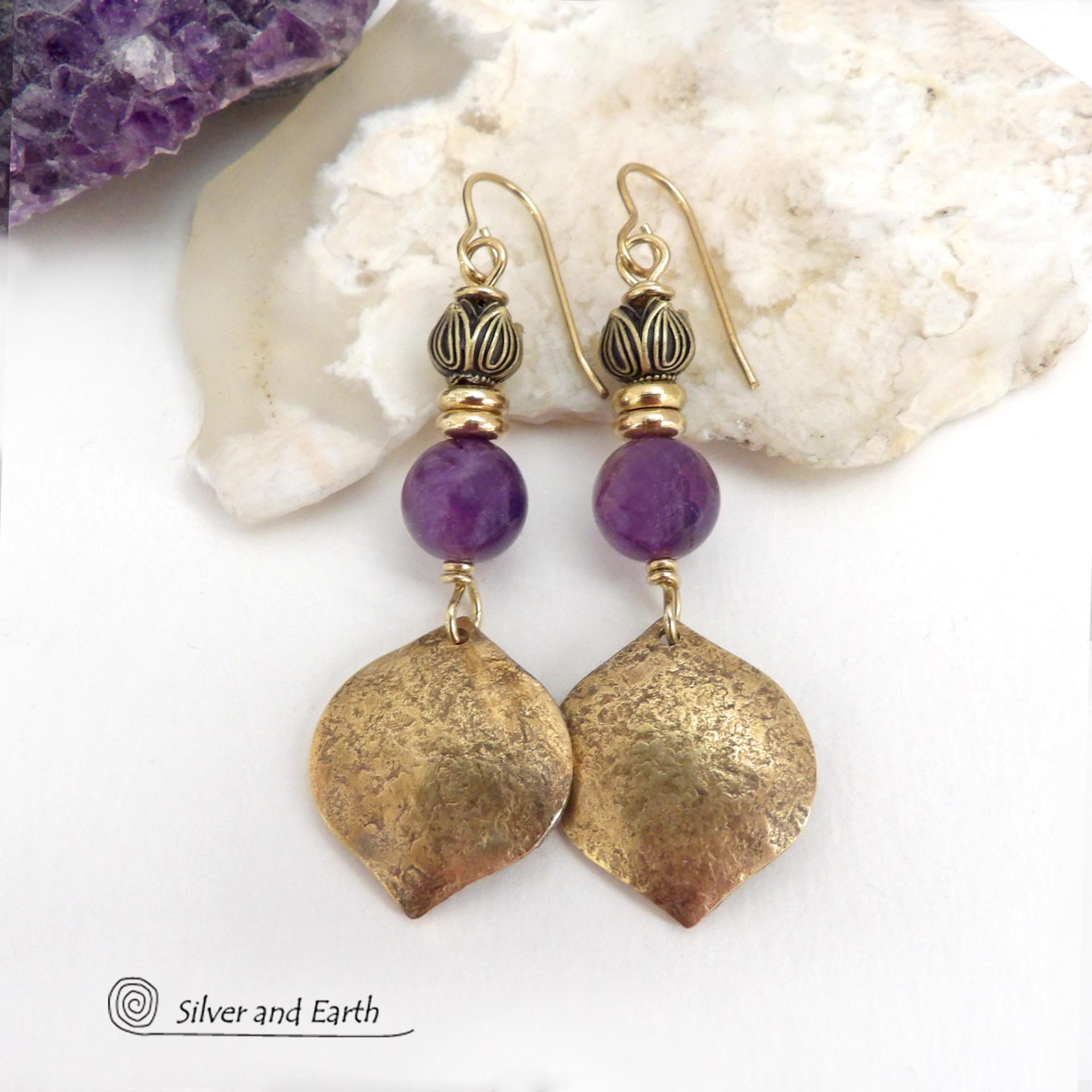 These handcrafted gold brass earrings have a hammered raw silk texture and are accented with natural purple amethyst gemstones, tiny brass beads and tulip flower-shaped brass beads. They have a modern elegant chic style that coordinates beautifully with all wardrobe types - dressed up or down. Makes a great gift for someone with a February birthday - amethyst is that month's birthstone. Handmade in the USA by Silver and Earth Jewelry. 