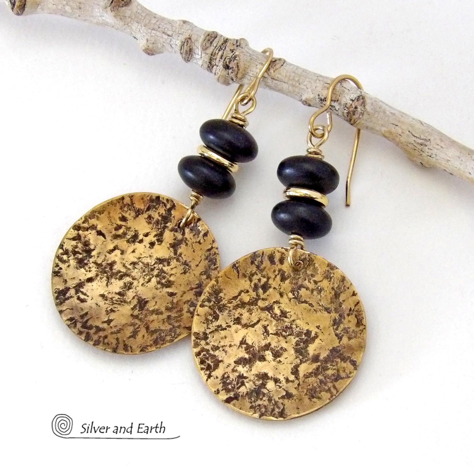 These handcrafted gold brass earrings have a hammered organic texture and are accented with black glass and shiny gold brass beads. They have a contemporary modern style with a timeless classic design that is always in fashion - dressed up or down. They'll coordinate beautifully with all wardrobe types. Makes a perfect 21st anniversary gift for your wife - brass is the traditional metal for this occasion. Handmade in the USA by Silver and Earth Jewelry. 