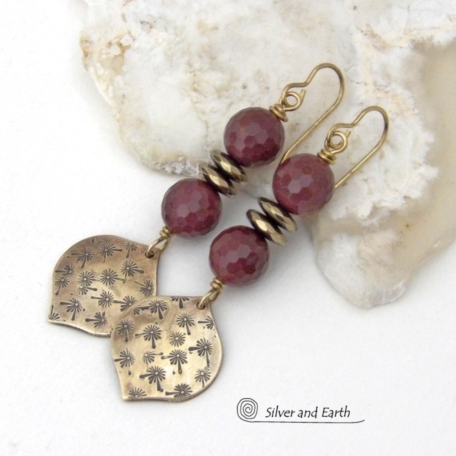 These handcrafted gold brass earrings have a hand stamped texture accented with micro-faceted deep burgundy mookaite gemstones and faceted hematite stone beads with an electroplated champagne gold tone finish. Mookaite is a unique, colorful type of jasper found at the Mooka Creek in Western Australia. These earrings have an elegant modern chic style that coordinates beautifully with all wardrobe types - dressed up or down. Handmade in the USA by Silver and Earth Jewelry.
