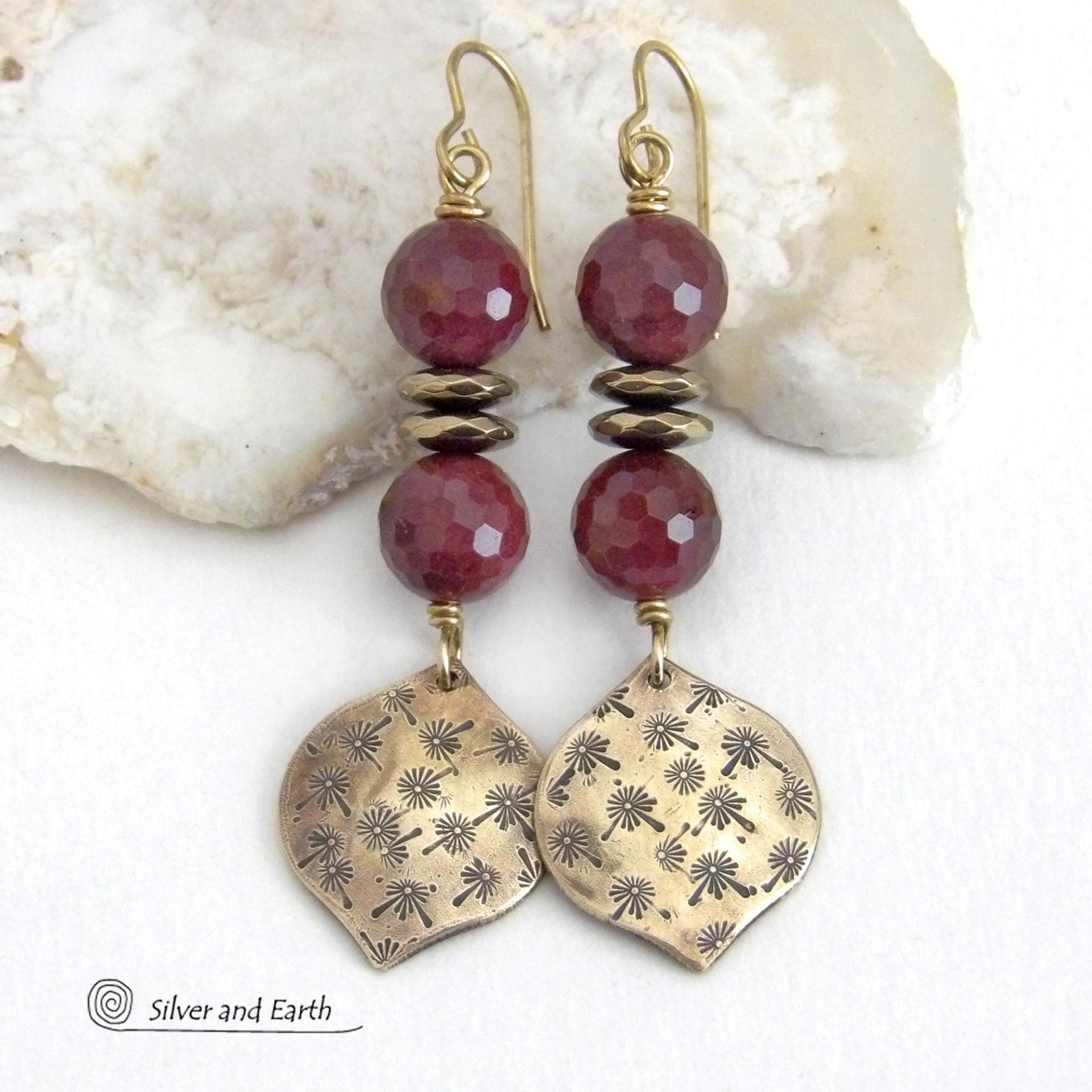 These handcrafted gold brass earrings have a hand stamped texture accented with micro-faceted deep burgundy mookaite gemstones and faceted hematite stone beads with an electroplated champagne gold tone finish. Mookaite is a unique, colorful type of jasper found at the Mooka Creek in Western Australia. These earrings have an elegant modern chic style that coordinates beautifully with all wardrobe types - dressed up or down. Handmade in the USA by Silver and Earth Jewelry.
