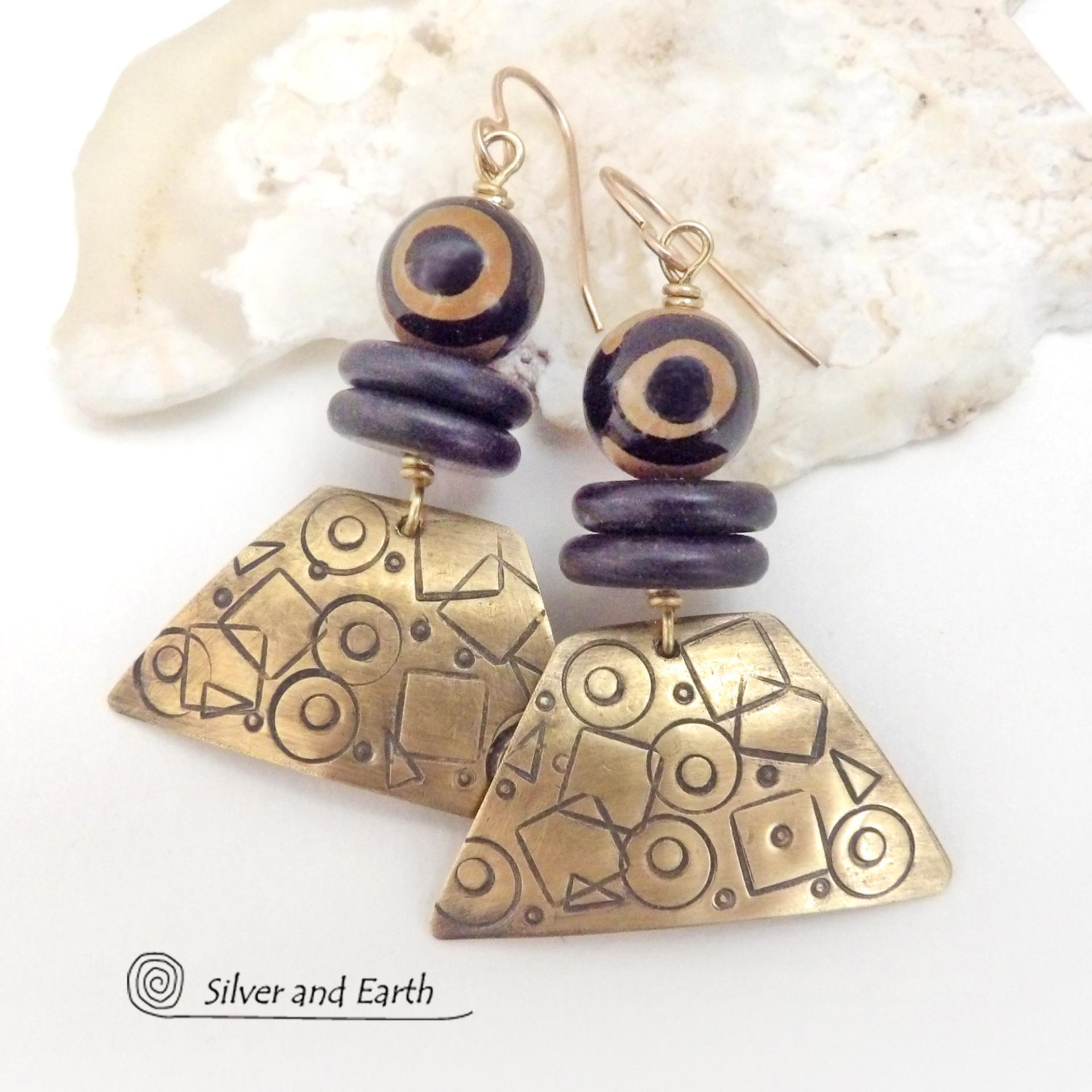 These handcrafted earrings have a mod, abstract hand stamped texture accented with brown and black Tibetan eye agate and black agate stones. Bold and unique - with an ethic tribal style - they'll make a striking statement.