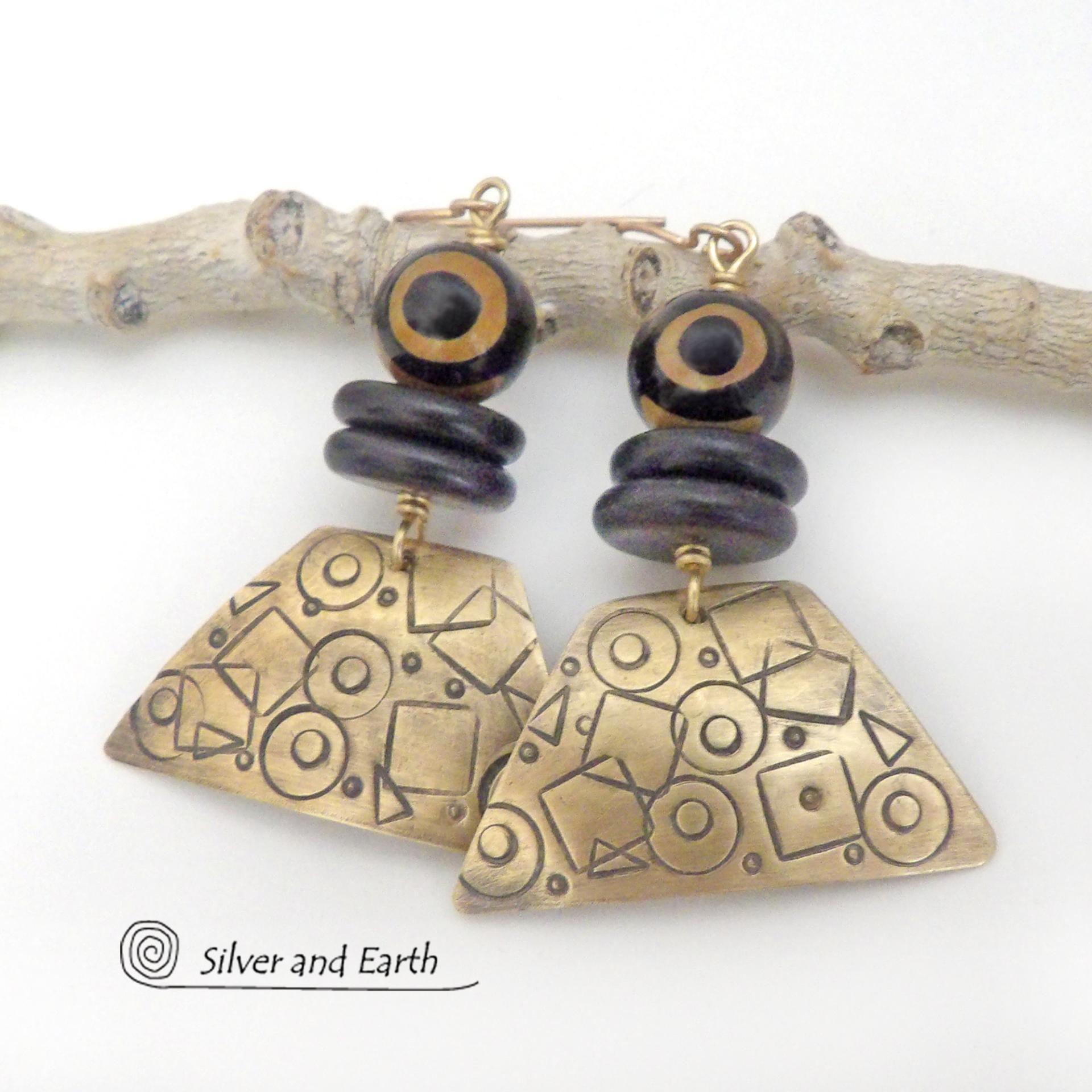 These handcrafted earrings have a mod, abstract hand stamped texture accented with brown and black Tibetan eye agate and black agate stones. Bold and unique - with an ethic tribal style - they'll make a striking statement.