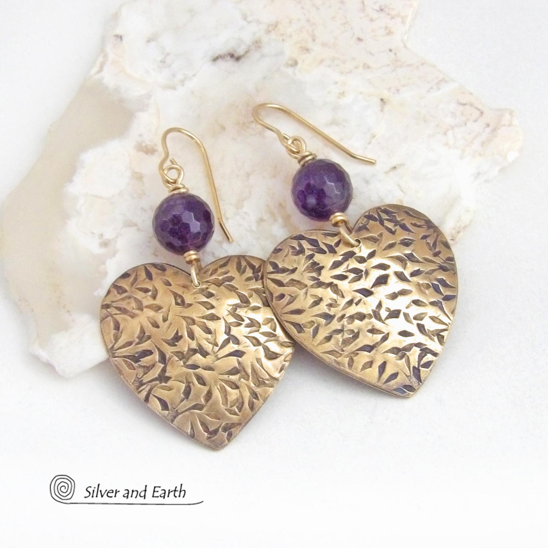 These handcrafted gold brass heart earrings have a hand stamped texture and are accented with faceted amethyst gemstones. Full of romantic charm, they'll make a great gift for someone special on Valentines' Day, a birthday, wedding anniversary -- or any day! They'll also make a great gift for someone born in February - amethyst is February's birthstone. Or a 6th wedding anniversary gift - amethyst is also the gemstone fo