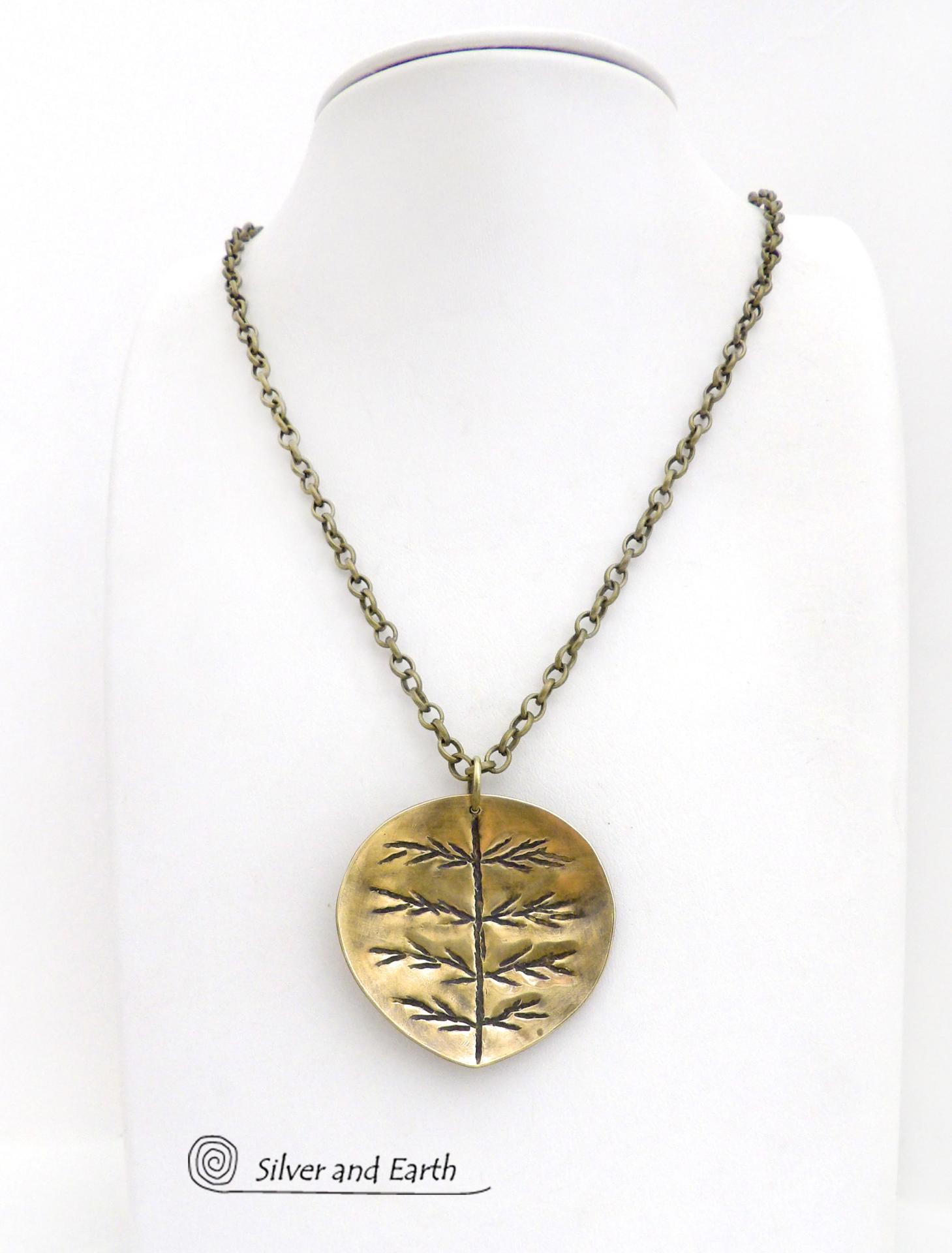 The perfect gift for nature lovers. This artisan handcrafted gold brass leaf pendant necklace has a modern earthy charm. It features a hand stamped texture pattern and comes on an 18" antiqued gold brass chain with lobster claw closure.