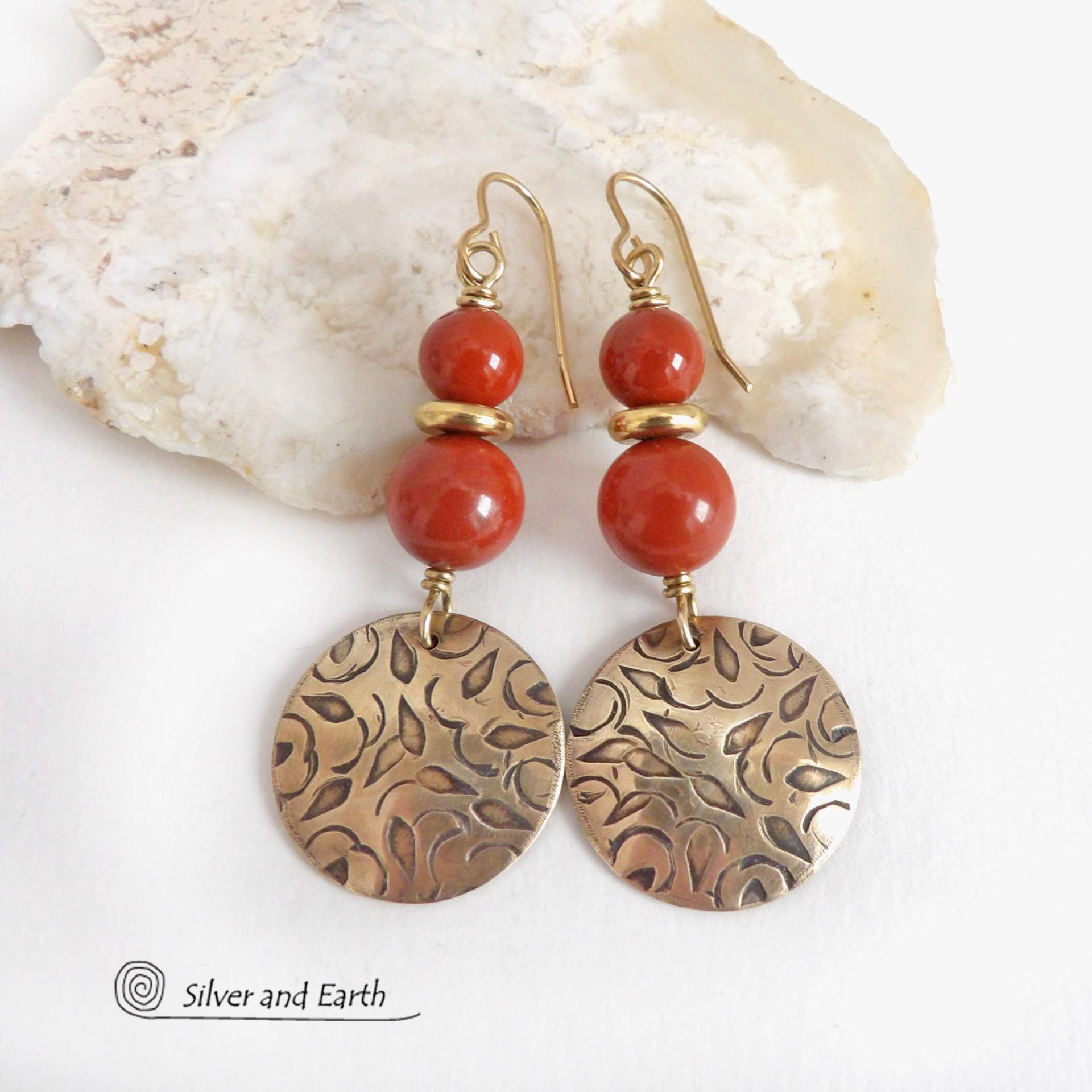 These handcrafted earrings have an elegant, modern chic style that coordinates beautifully with all wardrobe types -- dressed up or down. They feature gold brass dangles with a hand stamped texture accented with a stack of red jasper gemstones and shiny brass beads. They'll make a great gift for a natural gemstone lover - or a nice addition to your own jewelry wardrobe. Handmade in the USA by Silver and Earth jewelry.