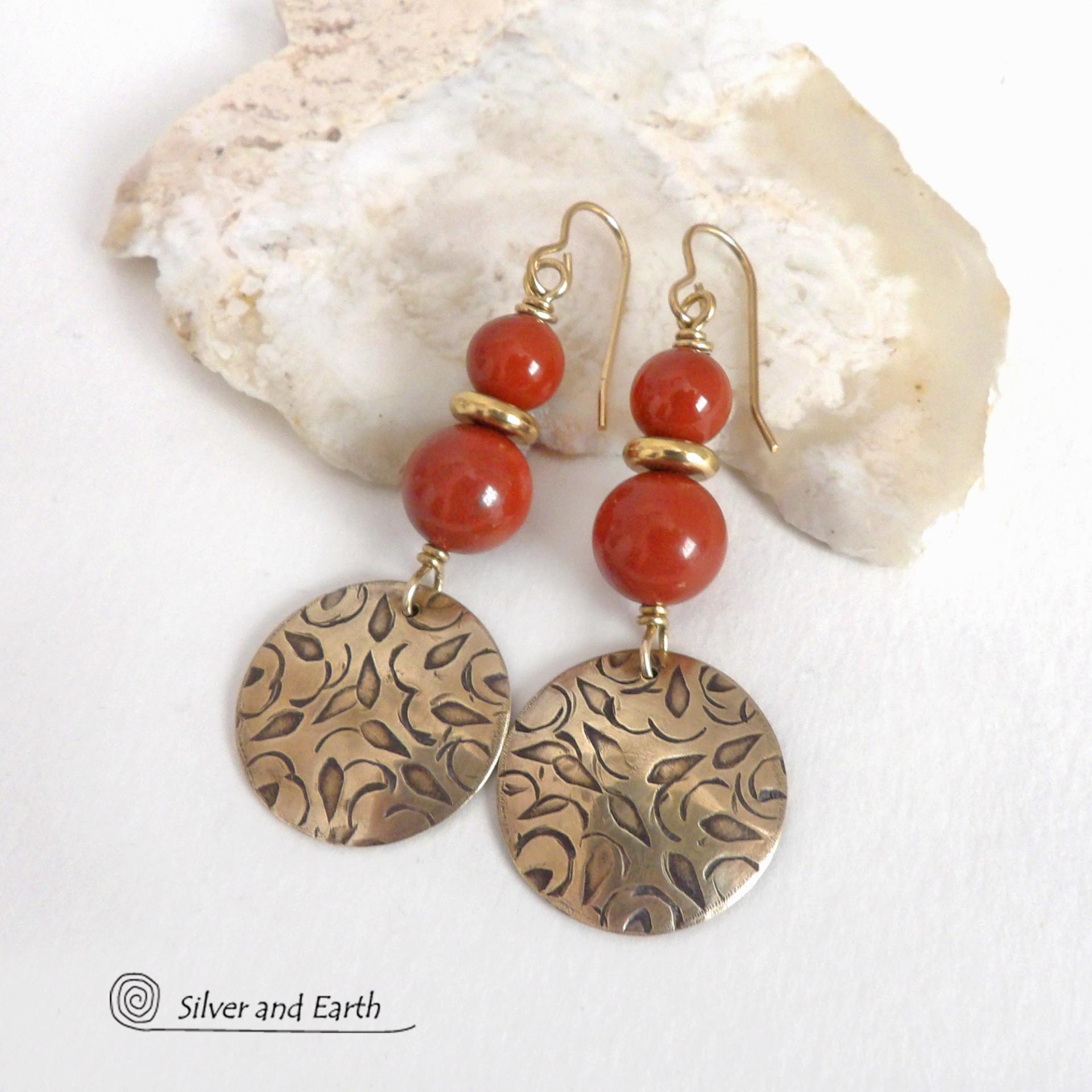These handcrafted earrings have an elegant, modern chic style that coordinates beautifully with all wardrobe types -- dressed up or down. They feature gold brass dangles with a hand stamped texture accented with a stack of red jasper gemstones and shiny brass beads. They'll make a great gift for a natural gemstone lover - or a nice addition to your own jewelry wardrobe. Handmade in the USA by Silver and Earth jewelry.