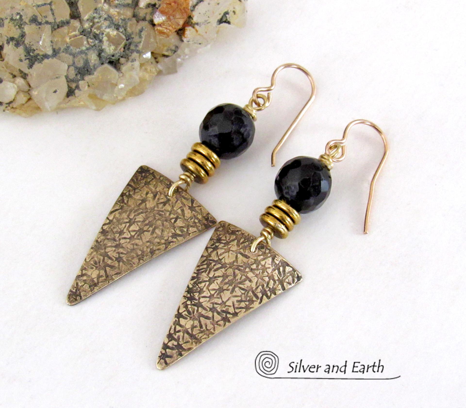These gold brass triangle earrings have a hand stamped texture and are accented with black onyx gemstones above a stack of tiny brass beads. The stones have a faceted finish which gives off a natural sparkle and shine. Lightweight and comfortable to wear - they have a modern chic contemporary style that coordinates well with all wardrobes types. Handmade in the USA by Silver and Earth Jewelry.