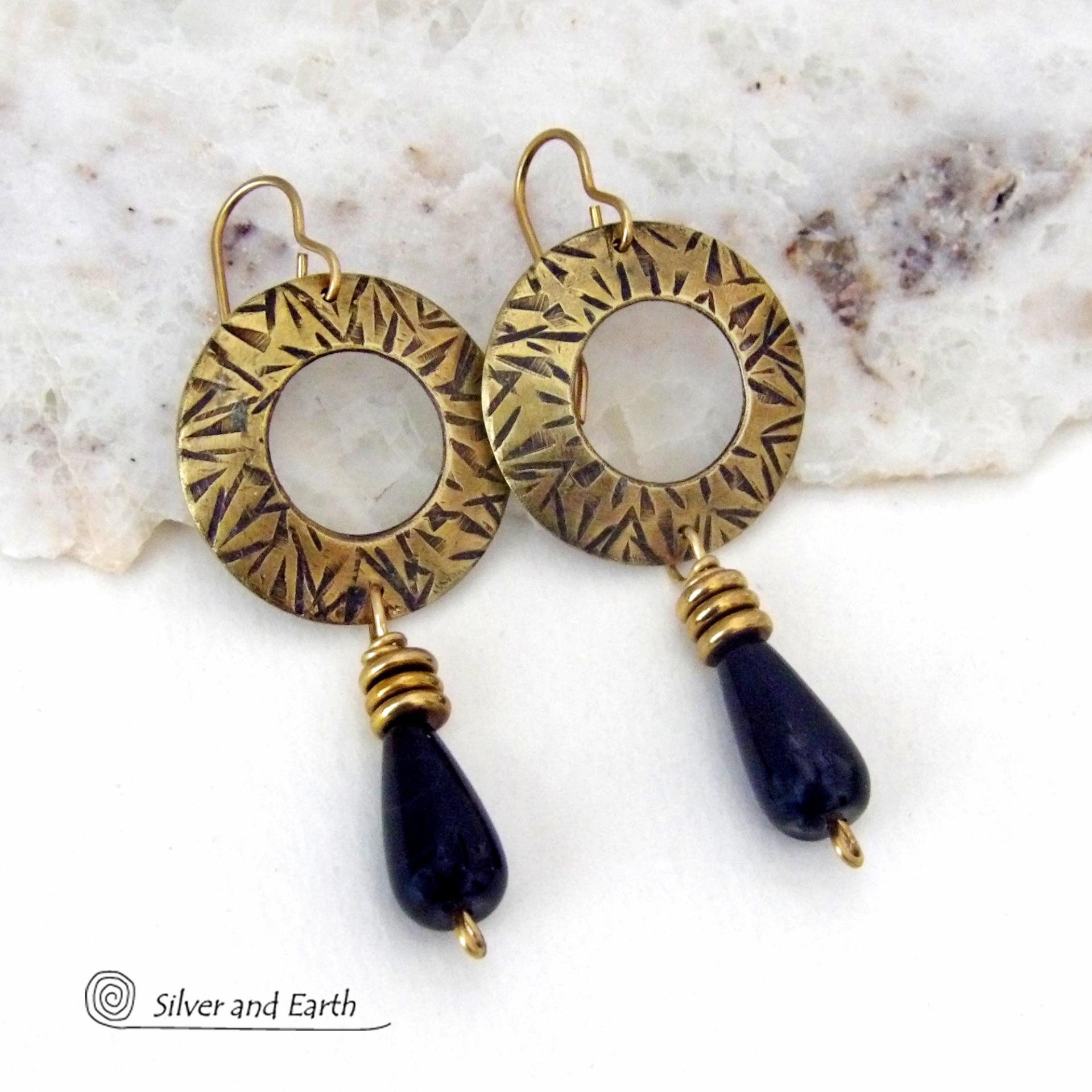 These handcrafted gold brass earrings have a hand stamped texture and are accented with teardrop shaped black onyx gemstones and brass beads. They have a modern chic vibe that coordinates beautifully with all wardrobe styles. Perfect for women that love to wear one of a kind artisan handcrafted jewelry. Handmade in the USA by Silver and Earth Jewelry. Total length of approximately 2-1/4" from top of brass ear wires and 1” at widest point. 